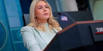 Karoline Leavitt stands at the podium as she gives press briefing on March 25, 2026.