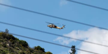 An Israeli Air Force UH-60 Black Hawk helicopter flies over the border area with southern Lebanon in northern Israel on March 2, 2026.