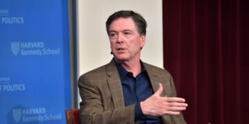 Former FBI Director James Comey speaks at Harvard Kennedy School with Harvard's Eric Rosenbach on Feb. 24, 2020, in Boston, Massachusetts.