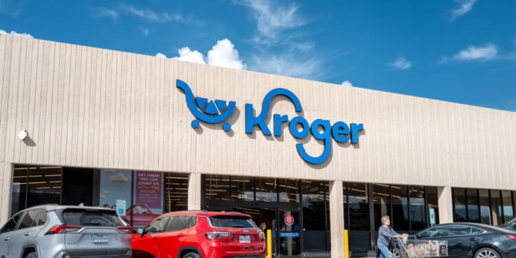 A person exits a Kroger grocery store in the Heights district on Oct. 8, 2025, in Houston, Texas.