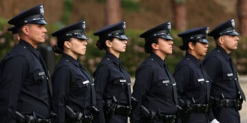 Los Angeles Police Department officer recruits from class 8-25 stand at attention during their graduation ceremony at the Los Angeles Police Academy in Los Angeles, California, on Feb. 6, 2026.