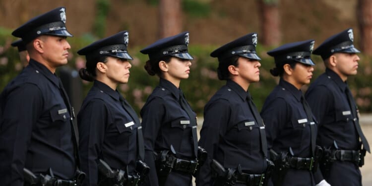Los Angeles Police Department officer recruits from class 8-25 stand at attention during their graduation ceremony at the Los Angeles Police Academy in Los Angeles, California, on Feb. 6, 2026.