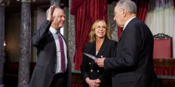GOP Sen. Alan Armstrong of Oklahoma, accompanied by his wife Shelly, participates in a ceremonial swearing in ceremony Tuesday with Senate President Pro Tempore Charles Grassley, an Iowa Republican, in the Old Senate Chamber at the U.S. Capitol Building in Washington, D.C. Armstrong, a longtime petroleum executive, was sworn in as an interim Senator for Oklahoma to replace Markwayne Mullin, who was tapped to replace Kristi Noem as the new secretary of homeland security.
