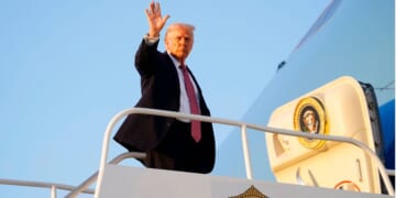 President Donald Trump departs Air Force One at Miami International Airport on Friday in Miami, Florida.