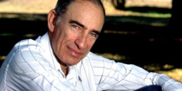 Paul Ehrlich pictured sitting down in field on April 5, 1993.