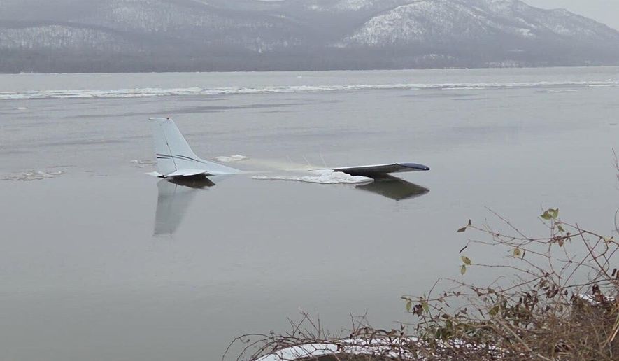 In this photo provided by the New York State Police, a single-engine Cessna 172 sits in the frigid Hudson River in Newburgh, N.Y., on Tuesday, March 3, 2026, after the pilot attempted an emergency landing Monday evening. (New York State Police via AP)