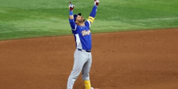 Eugenio Suárez of Team Venezuela points to the sky after hitting an RBI double against Team United States that gave Venezuela the winning run in the World Baseball Classic final on Tuesday at loanDepot Park in Miami.
