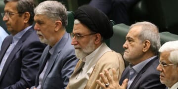 Iran's Minister of Intelligence Esmail Khatib, center, is pictured on Aug. 17, 2024, with Iran's President Masoud Pezeshkian (center right) before a speech to members of parliament in Tehran. Khatib was reportedly killed Tuesday night.