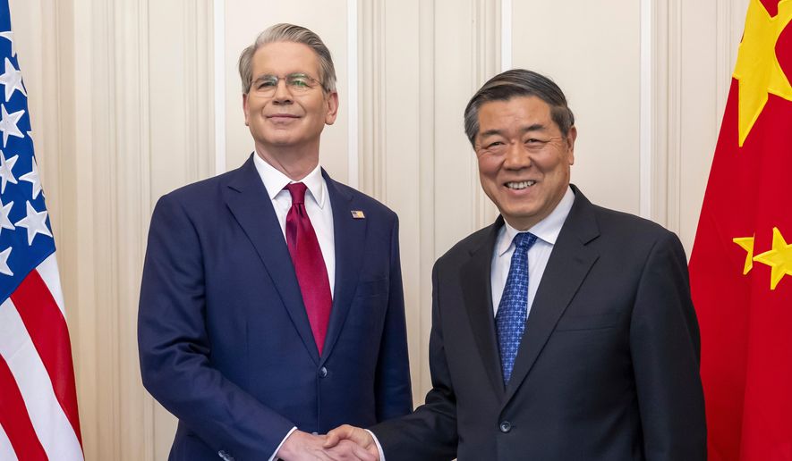 FILE - U.S. Secretary of the Treasury Scott Bessent, left, shakes hands with Chinese Vice Premier He Lifeng, right, during a bilateral meeting between the United States and China, in Geneva, Switzerland, on Saturday, May 10, 2025. (Martial Trezzini/Keystone via AP, File)