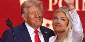 President Donald Trump and Erika Kirk are pictured together in a Sept. 21 photo at the memorial for Kirk's husband, Charlie. Trump has appointed Erika Kirk to take her husband's place on the Air Force Academy Board of Visitors.