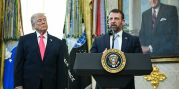 President Donald Trump watches as Secretary of Homeland Security Markwayne Mullin speaks in the Oval Office of the White House on March 4, 2026 in Washington, DC.