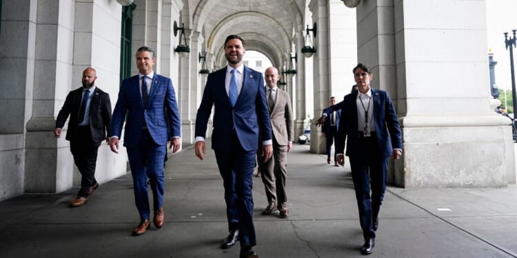 War Secretary Pete Hegseth, Vice President J.D. Vance, and White House Deputy Chief of Staff Stephen Miller arrive to meet with members of the National Guard during a visit to Union Station on Aug. 20, 2025, in Washington, D.C.