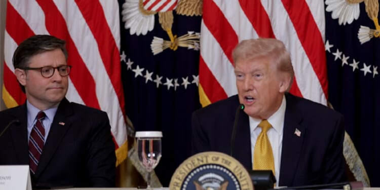 President Donald Trump and House Speaker Mike Johnson meet with reporters Monday in the East Room of the White House.