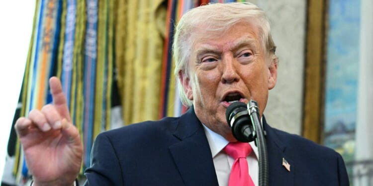 President Donald Trump speaks during a ceremony in the Oval Office of the White House in Washington, DC on March 24, 2026.