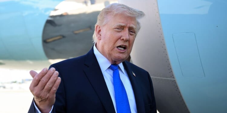 President Donald Trump speaks to reporters before boarding Air Force One at Palm Beach International Airport on March 23, 2026, in West Palm Beach, Florida.