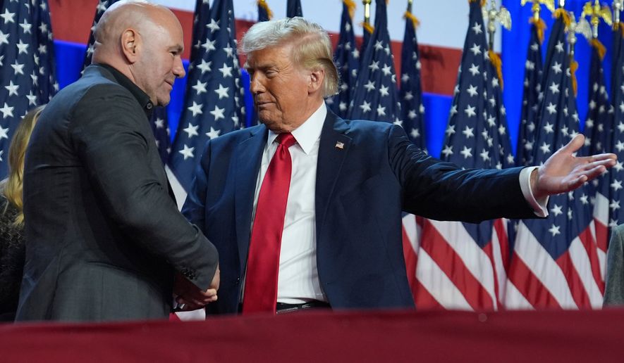 Republican presidential nominee former President Donald Trump talks with UFC CEO Dana White at an election night watch party at the Palm Beach Convention Center, Nov. 6, 2024, in West Palm Beach, Fla. (AP Photo/Evan Vucci, File)