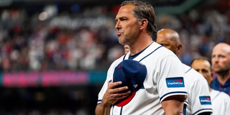 Manager Mark Deosa of the United States stands for the national anthem before a World Baseball Classic Pool B game between Great Britain and the United States at Daikin Park on March 7, 2026 in Houston, Texas.