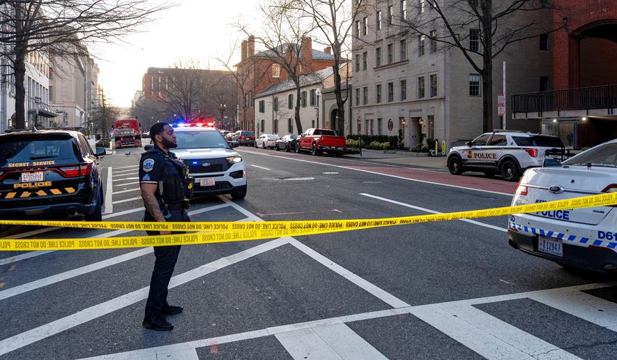 Washington Metropolitan Police Department officers block the streets around the White House as members of the U.S. Secret Service investigate a suspicious vehicle, Wednesday, March 11, 2026, in Washington. (AP Photo/Alex Brandon)