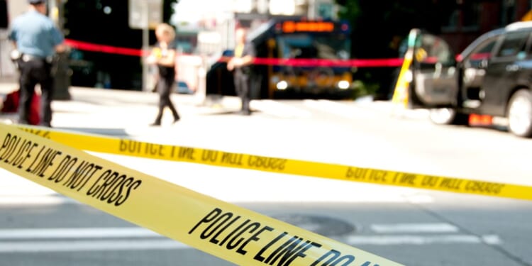 Investigators said the woman was found at the bus stop with 30 stab wounds.