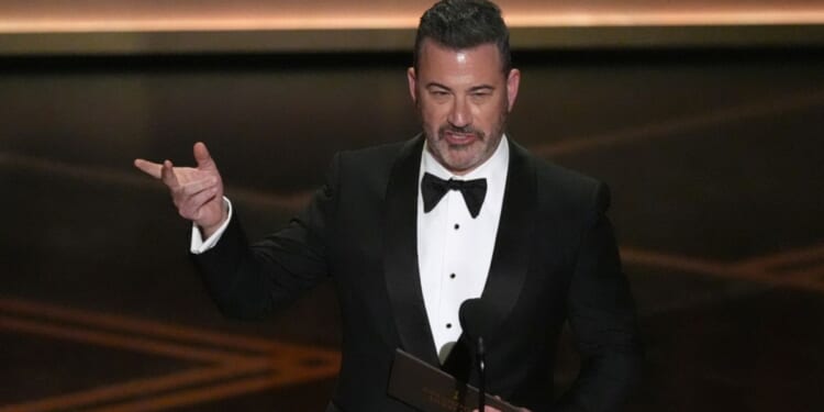 Jimmy Kimmel presents the award for best documentary short film Sunday during the Oscars in Los Angeles.