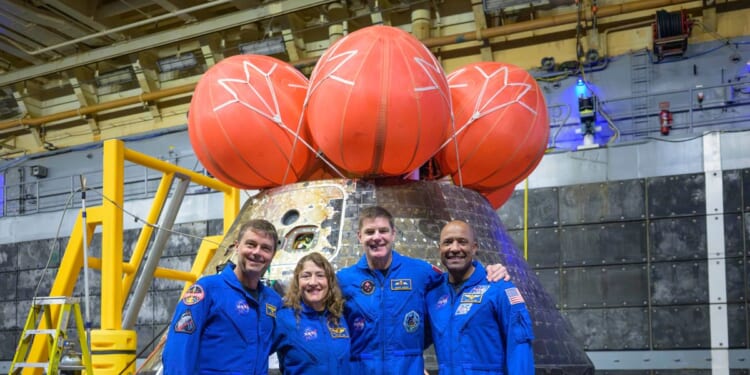 Artemis II’s moon-traveling astronauts return home to cheers after a record-breaking trip