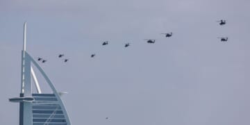 United Arab Emirates army helicopters fly past Burj al Arab hotel in Dubai on Jan. 16, 2026.
