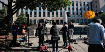 Members of the news media set up outside the E. Barrett Prettyman United States Court House Monday in Washington, D.C., where the alleged White House Correspondents' Dinner gunman, Cole Allen, was expected to be arraigned.