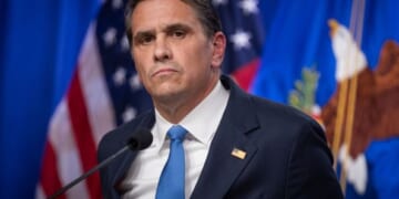 Acting Attorney General Blanche stands at a podium in the Department of Justice press room on April 21, 2026.