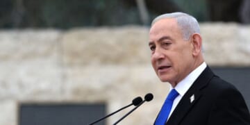Israeli Prime Minister Benjamin Netanyahu speaks during a ceremony commemorating Israel's Remembrance Day for fallen soldiers, or Yom HaZikaron, at the Military Cemetery on Mount Herzl in Jerusalem on April 21, 2026.