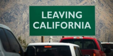 A leaving California sign at the border of the Golden State.