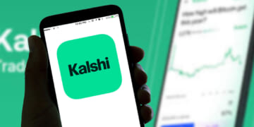The Kalshi online betting app logo is seen displayed on a smartphone screen.
