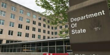 A sign for the Department of State stands outside a US diplomacy building in Washington, DC on April 19, 2019.