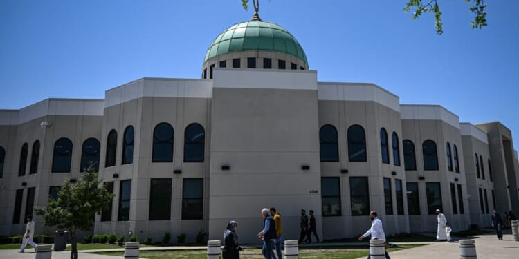 A mosque stands as people arrive to attend prayers in Plano, Texas, on April 11, 2025.