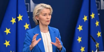 European Union President Ursula Von Der Leyen stands at a podium as she speaks to the press on April 13, 2026.