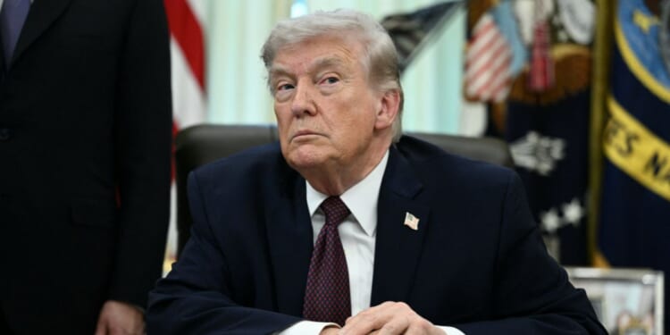 President Donald Trump takes a question from a reporter in the Oval Office of the White House in Washington, DC on March 31, 2026.