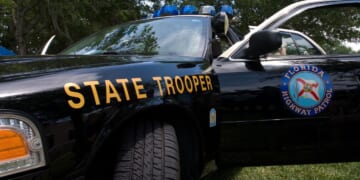 A Florida state trooper vehicle sits in the daylight.