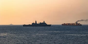 In this handout photo provided by U.S. Central Command, U.S. forces patrol the Arabian Sea near M/V Touska on April 20, 2026, after firing upon the Iranian-flagged vessel that the U.S. accused of attempting to violate the U.S. naval blockade of Iranian ports near the Strait of Hormuz.