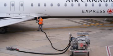 A worker fuels an Air Canada plane on April 14, 2026.