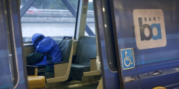 A passenger naps on a train at the MacArthur BART station in Oakland, Calif. on Tuesday, May 12, 2020. BART is joining transit agencies from around the country in seeking economic federal relief funds because of dwindling ridership during the coronavirus shutdown. (Photo By Paul Chinn/The San Francisco Chronicle via Getty Images) Crime