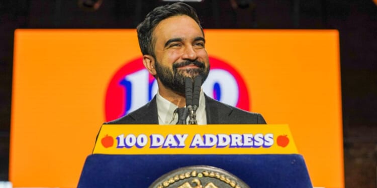 Mayor Zohran Mamdani of New York stands at a podium to deliver his 100 day address on April 12, 2026.