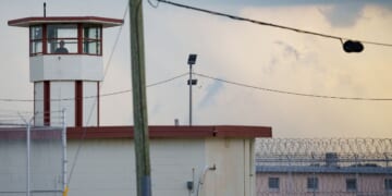A Louisiana corrections officer looks out from a tower by Camp 57 at Angola Prison, the Louisiana State Penitentiary and America's largest maximum-security prison farm, in West Feliciana Parish, Louisiana, near the town of St. Francisville on Sept. 3, 2025.