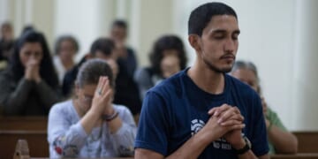 Nicaraguans attend a mass during celebrations in a church in San Jose, Costa Rica, on Dec. 7, 2023.