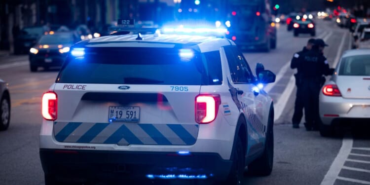 Chicago Police Department officers respond to the scene of an incident on March 29, 2022.