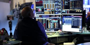 A trader works on the floor of the New York Stock Exchange during the opening bell in New York, on April 13, 2026.