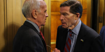 Sen. Peter Welch (D-VT) and Sen. Richard Blumenthal (D-CT) speak outside of the Senate Chambers.