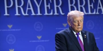 President Donald Trump bows his head in prayer during the National Prayer Breakfast at the Washington Hilton in Washington, D.C., on Feb. 5, 2026.
