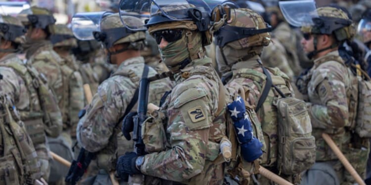 Soldiers stand in Los Angeles as they regulate protests on June 12, 2025.