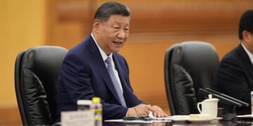 Chinese President Xi Jinping seated