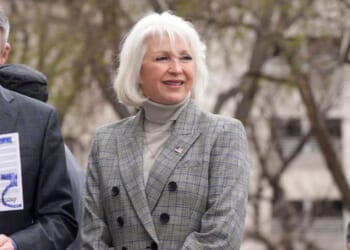Mesa County Colorado clerk Tina Peeters walks on the steps of the state Capitol on April 5, 2022.
