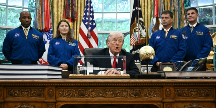 US President Donald Trump speaks as he welcomes the Artemis II astronauts, from L to R, Victor Glover, Christina Koch, Reid Wiseman and Jeremy Hansen in the Oval Office at the White House in Washington, DC, on April 29, 2026.
